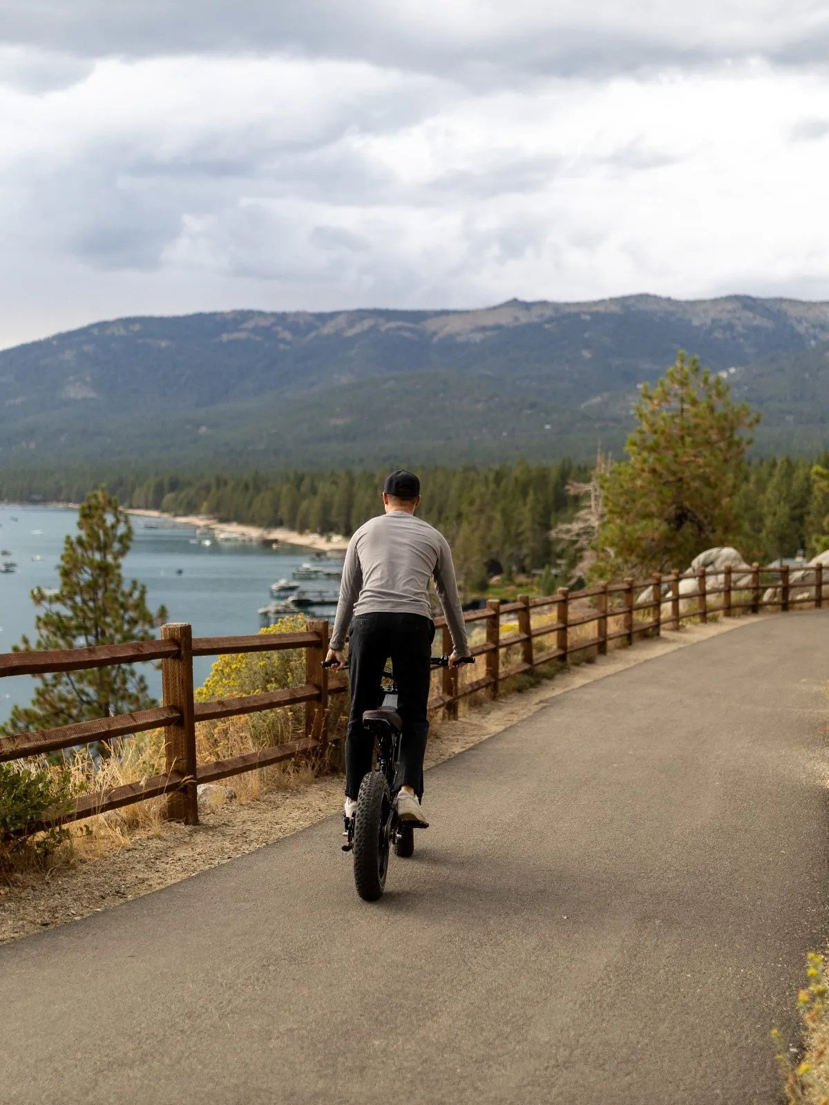 Surfline overlooking Lake Tahoe from a dirt turnout, editorial landscape